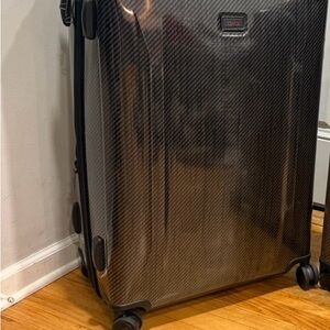 Tumi Black Carbon Fiber Style Suitcase